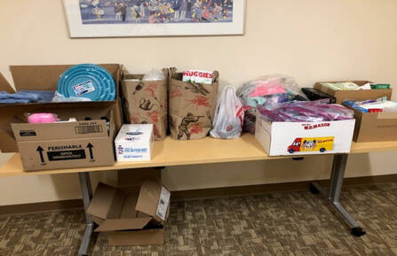 Image of boxes and bags filled with donations