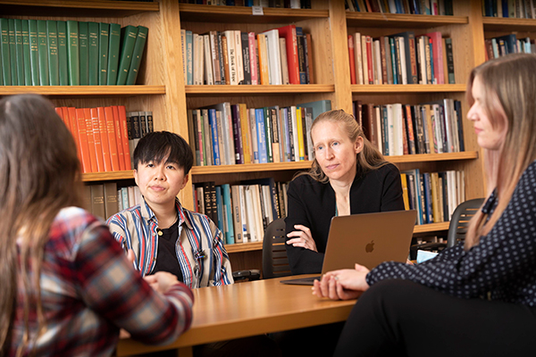 Four people in conversation around a table