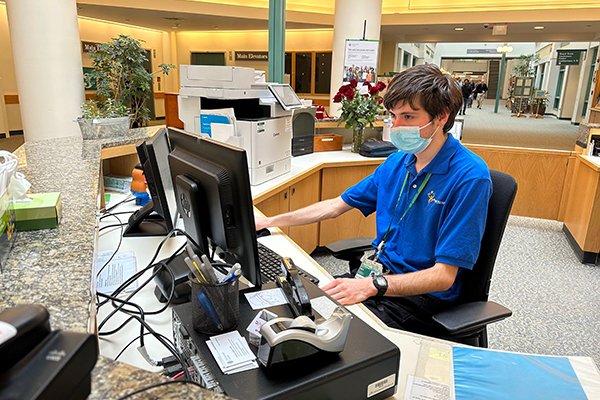 Student working at a computer in the hospital