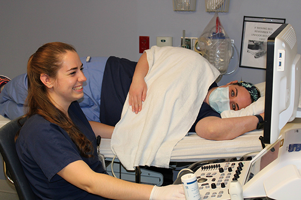 Two students in a medical training environment