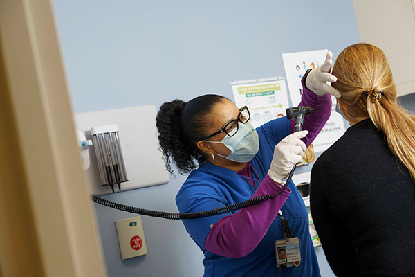 A student working with a patient as part of a Workforce Readiness Institute program