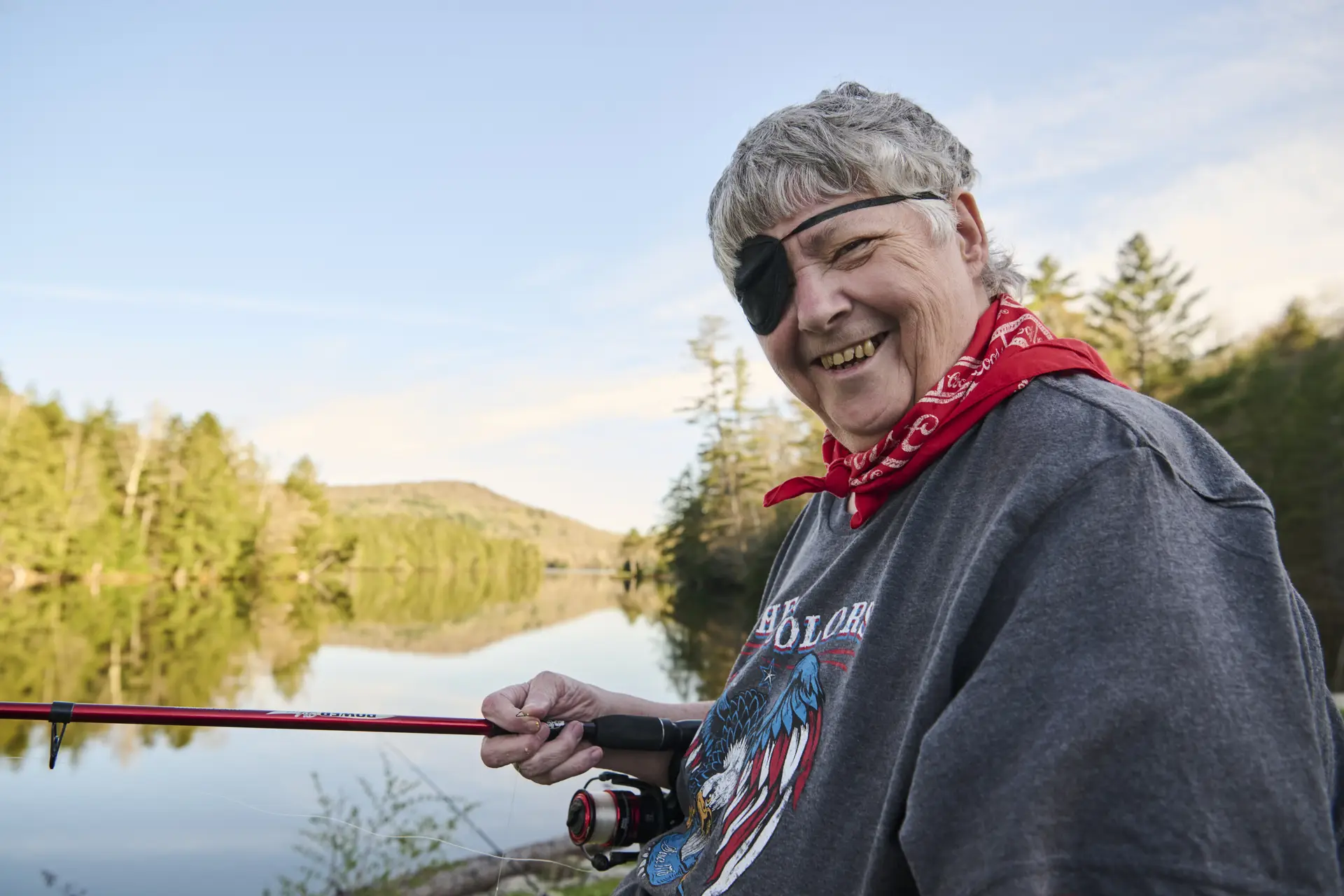 Kathy Ryan fishing on a lake