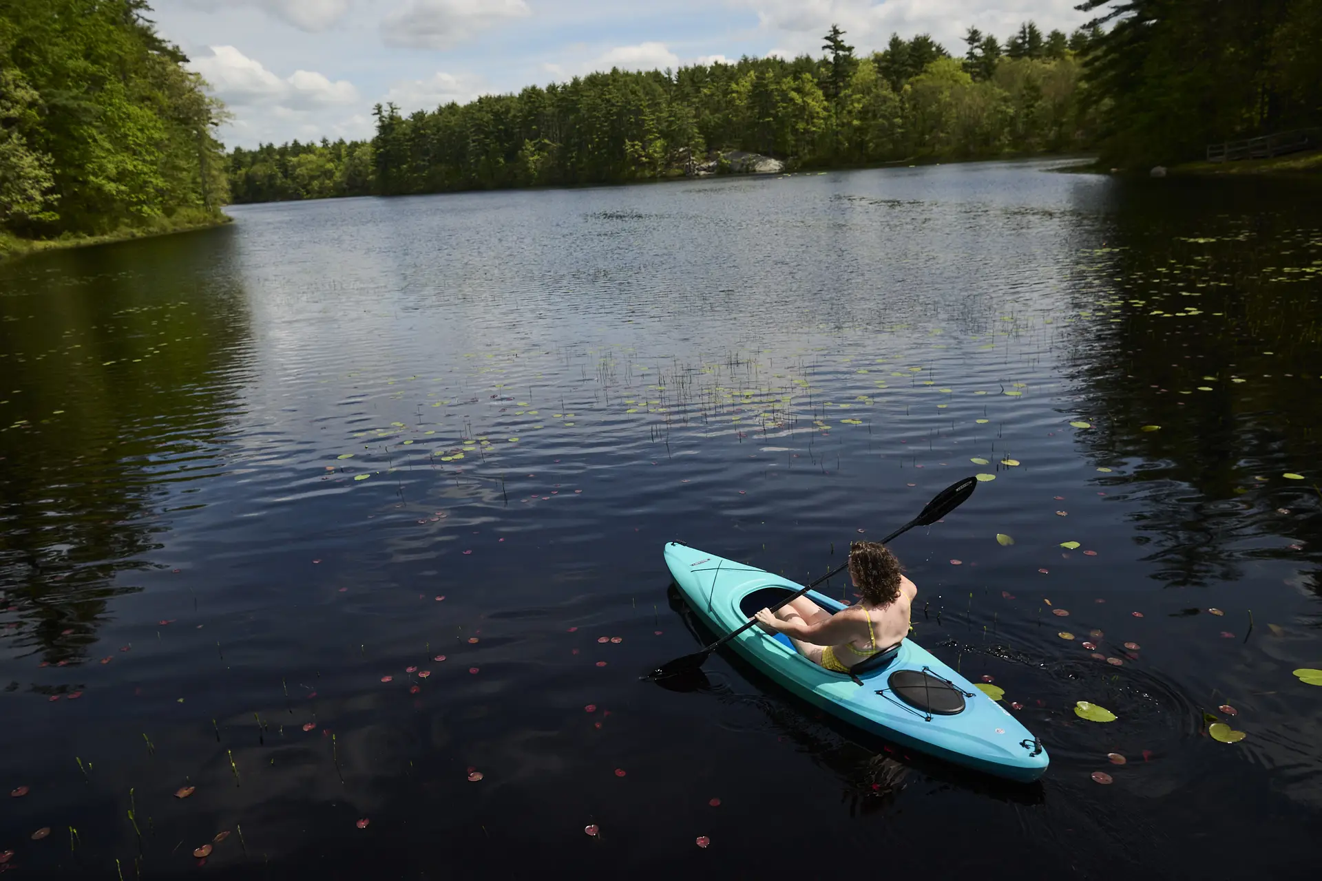 Crystal Kebler kayaking on a lake