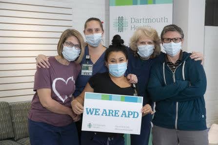 Four APD nurses holding a "We are APD" sign