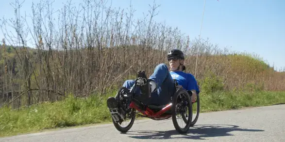 Patient Chris Burge riding a recumbent bicycle