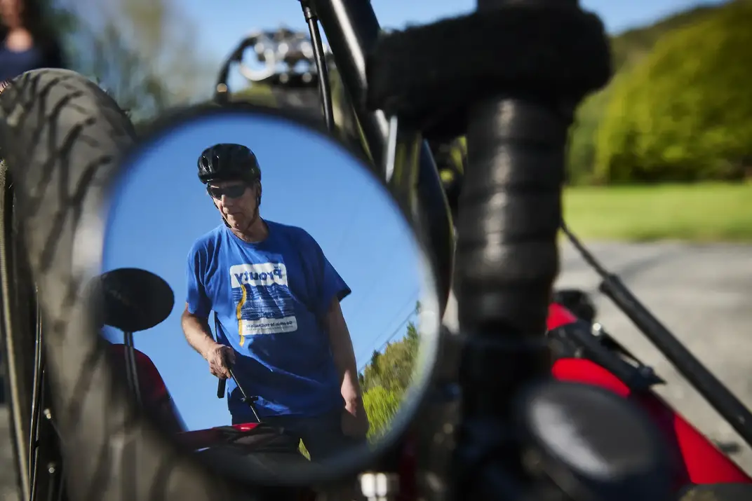 Patient Chris Burge seen in the rear-view mirror of his bicycle