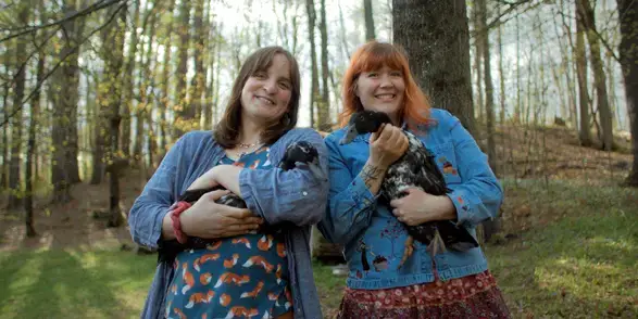 Patient Clover McHugo and a friend holding hens