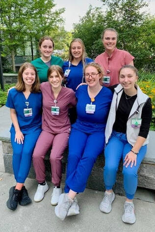 A group of LNA nursing students sitting outside