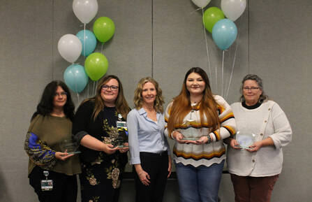 Award winners pose with awards