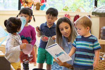 Dartmouth Health Child Care Center DHMC teacher with preschoolers.