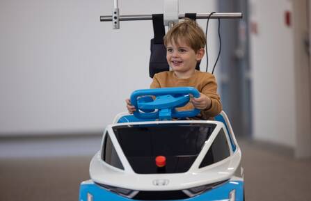 CHaD patient Sam Wood, 3, test drives the Honda Shogo.