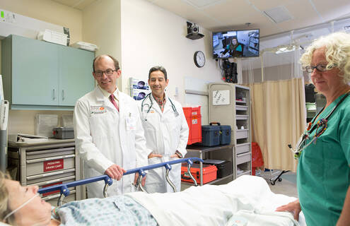 Trey Dobson, MD, speaking with a patient