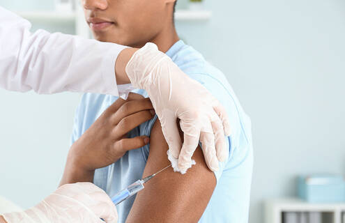 Young man receiving a flu shot