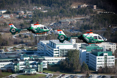 DHart Helicopters shown flying over Dartmouth Hitchcock Medical Center in Lebaonon, NH