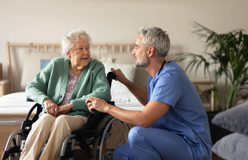 Man talking to an elderly patient