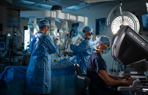Henry J. Tannous, MD, and Jose R. Rodriquez, MD, working with the da Vinci robot system.