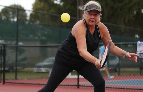 woman playing pickle ball