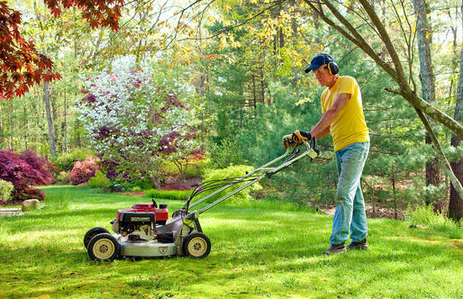 man mowing yard