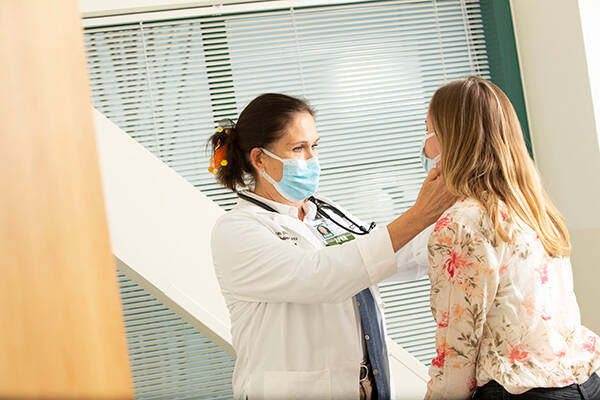 A nurse examining a patient