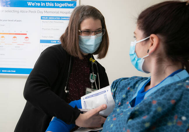 Kristie Foster, MSN, RN, GERO-BC, with a patient