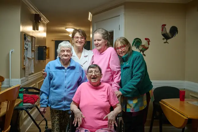 Nurse Susan Januszewski poses with several other patients