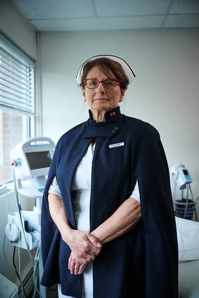 Nurse Susan Januszewski stands in a hospital room