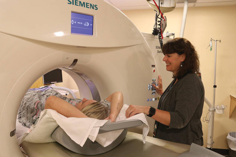 MRI technician with patient